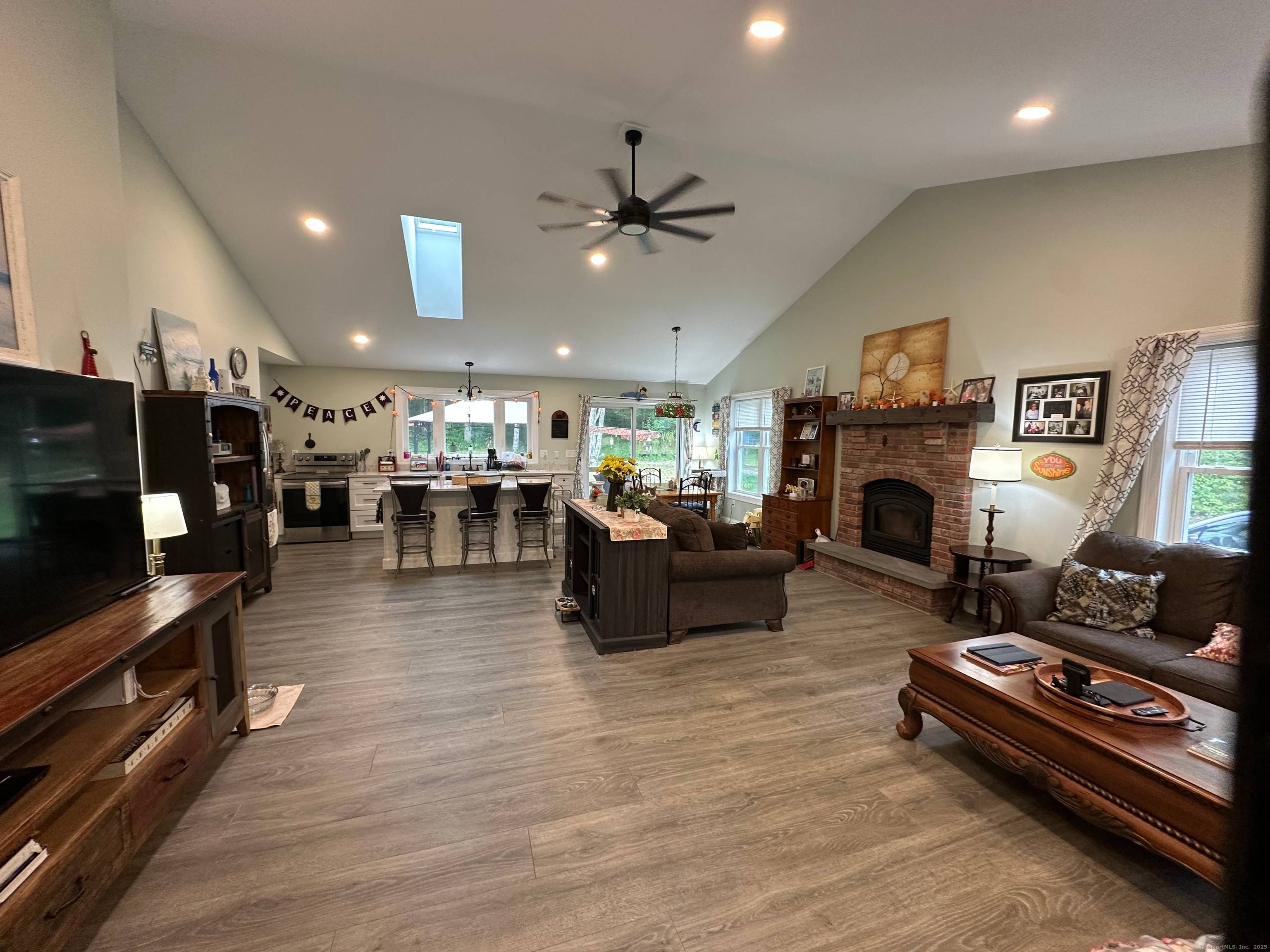 Set on scenic acreage, this inviting single level ranch offers a seamless blend of comfort and natural beauty.