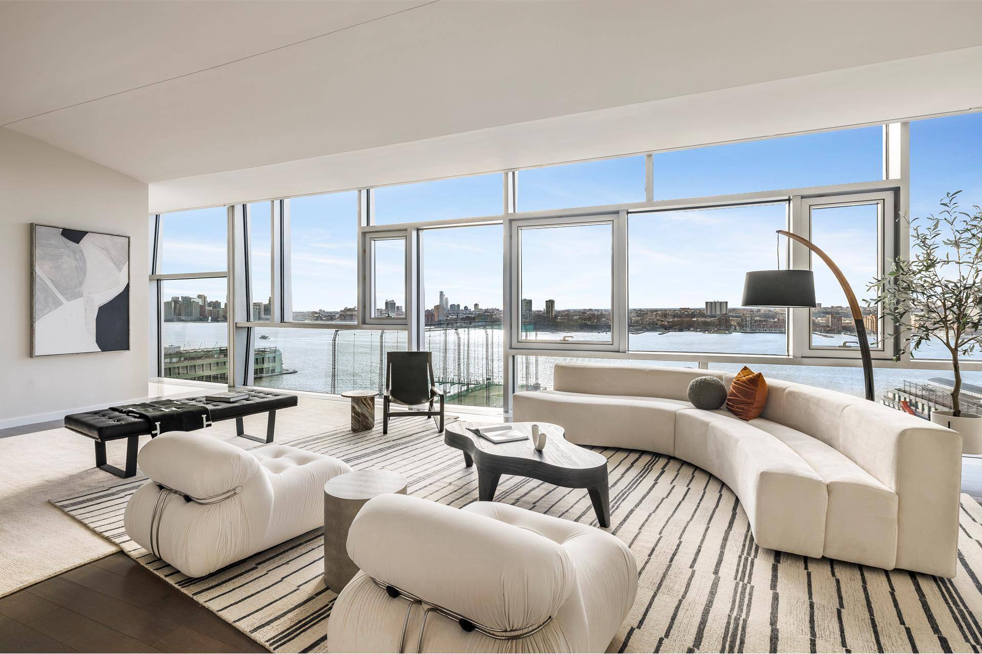 This extraordinary four bedroom, five full bath, and two half bath residence offers sweeping river views that capture the beauty of New York City from dawn till dusk.