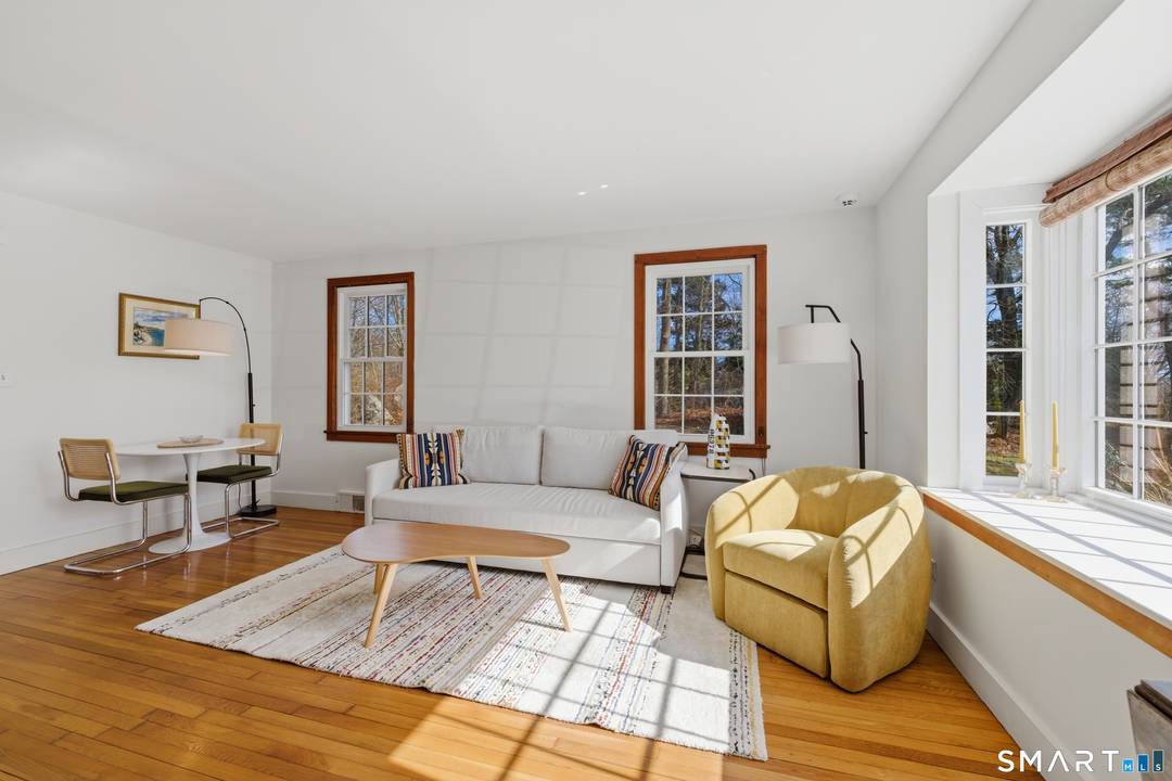 Discover the charm of coastal living with this turn key New England summer cottage, ideally situated between Stonington and Mystic just one mile outside the borough.