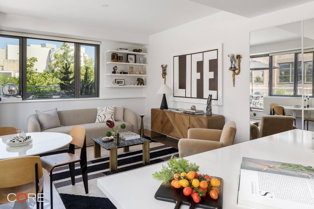 Welcome to a home that feels less like an apartment and more like a private sanctuary nestled into the heart of downtown Manhattan.