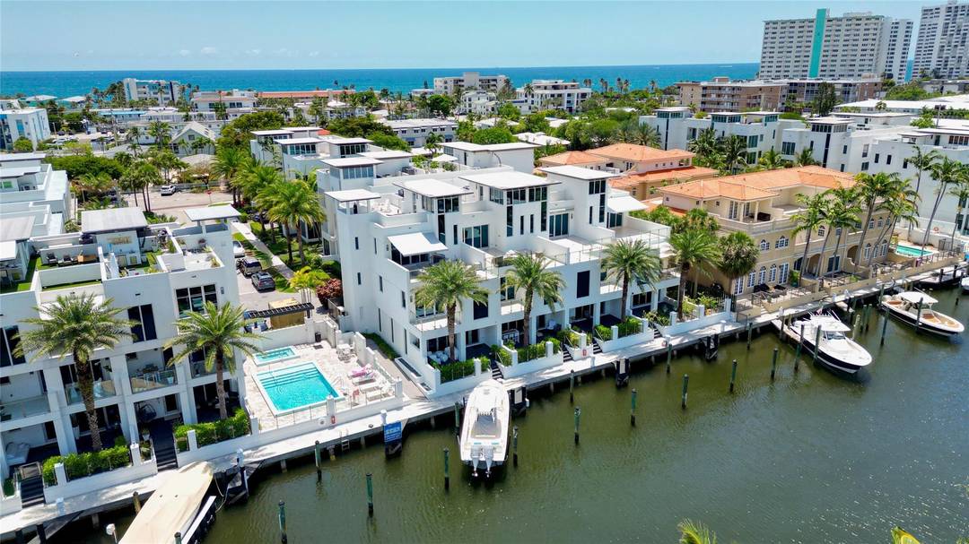 Coastal charm meets elevated elegance at this four level, modern townhouse in the beach town of Lauderdale by the Sea.