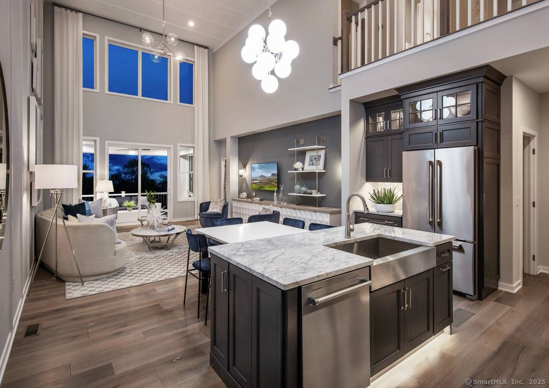 This is the Pierpont Modern Farmhouse a two story townhome with primary bedroom on the main floor and two bedrooms up and a loft.