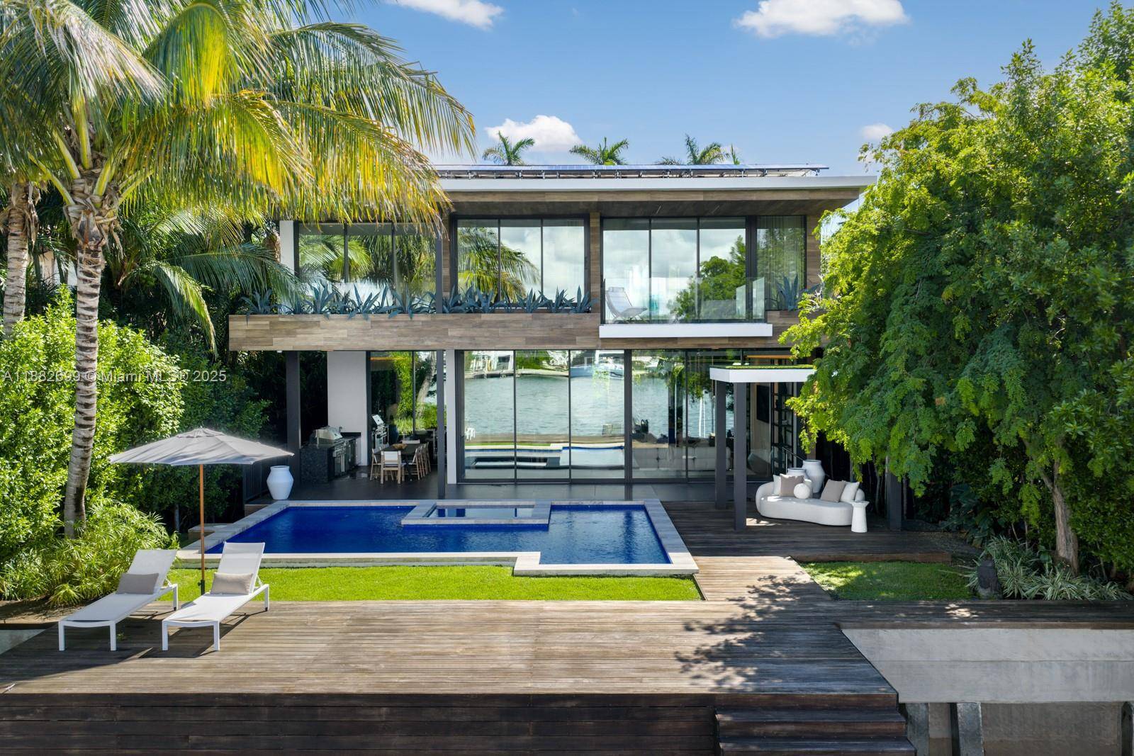 Waterfront luxury in this low impact Modern, meticulously designed by Max Strang, nestled in the prestigious Venetian Islands.