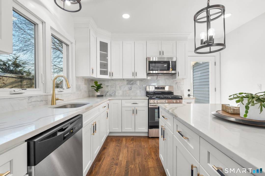 Newly renovated 4 bedroom, 2 bath home featuring a stunning modern kitchen and desirable open concept layout.