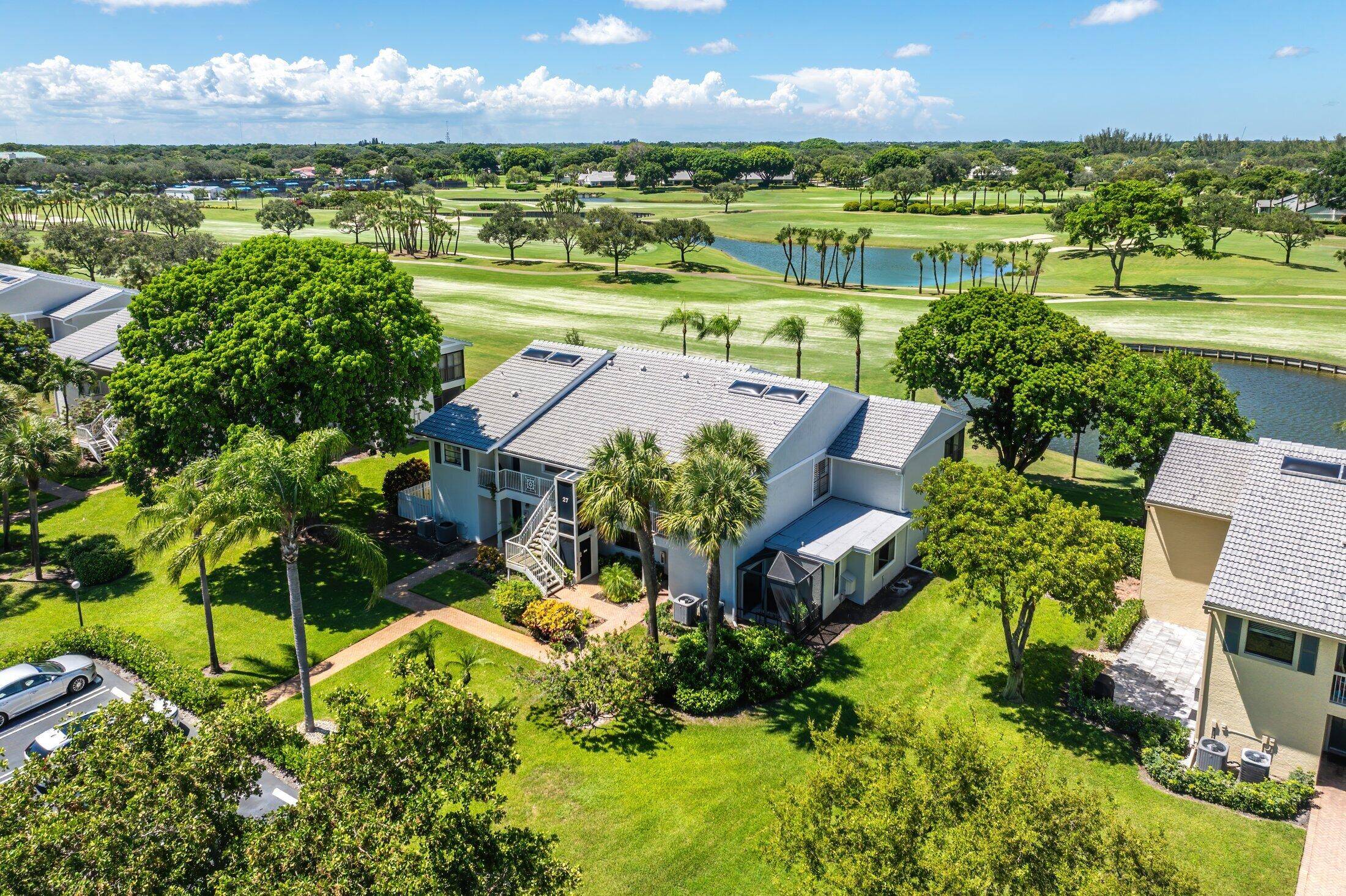 This spacious, sun filled 2nd floor condo showcases breathtaking lake and golf course views.