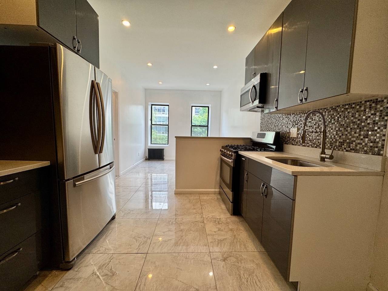 Welcome home to this newly renovated proper 2 bedroom, plus home office walk in storage closet, in the Lower East Side.