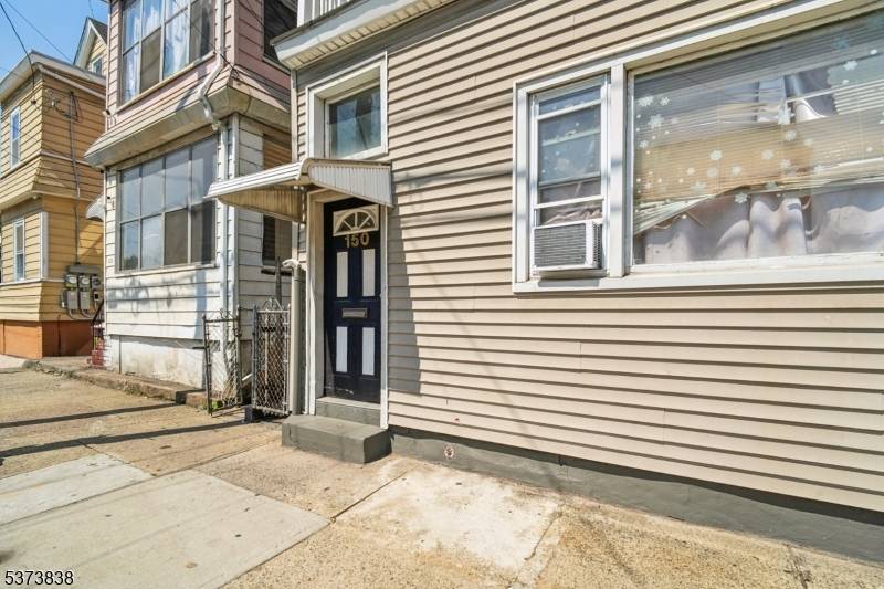 Welcome to Paterson ! Exceptional investment opportunity featuring a fully occupied three unit property with solid financials.