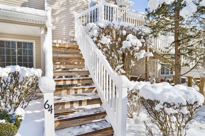 LOCATION ! This 2nd story one level condominium backs up to approximately 175 acre of dedicated woodbelt area.