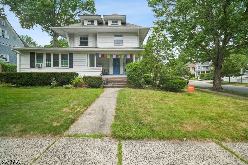 This sun filled 4 bedroom, 2 bath apartment spans the second and third floors of a well maintained two family home.