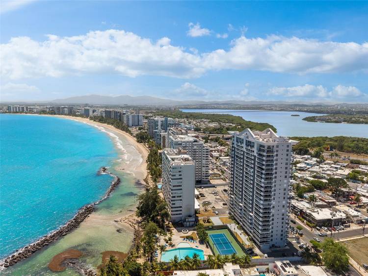 completely reimagined corner residence where refined design, expansive views, and effortless coastal living come together.