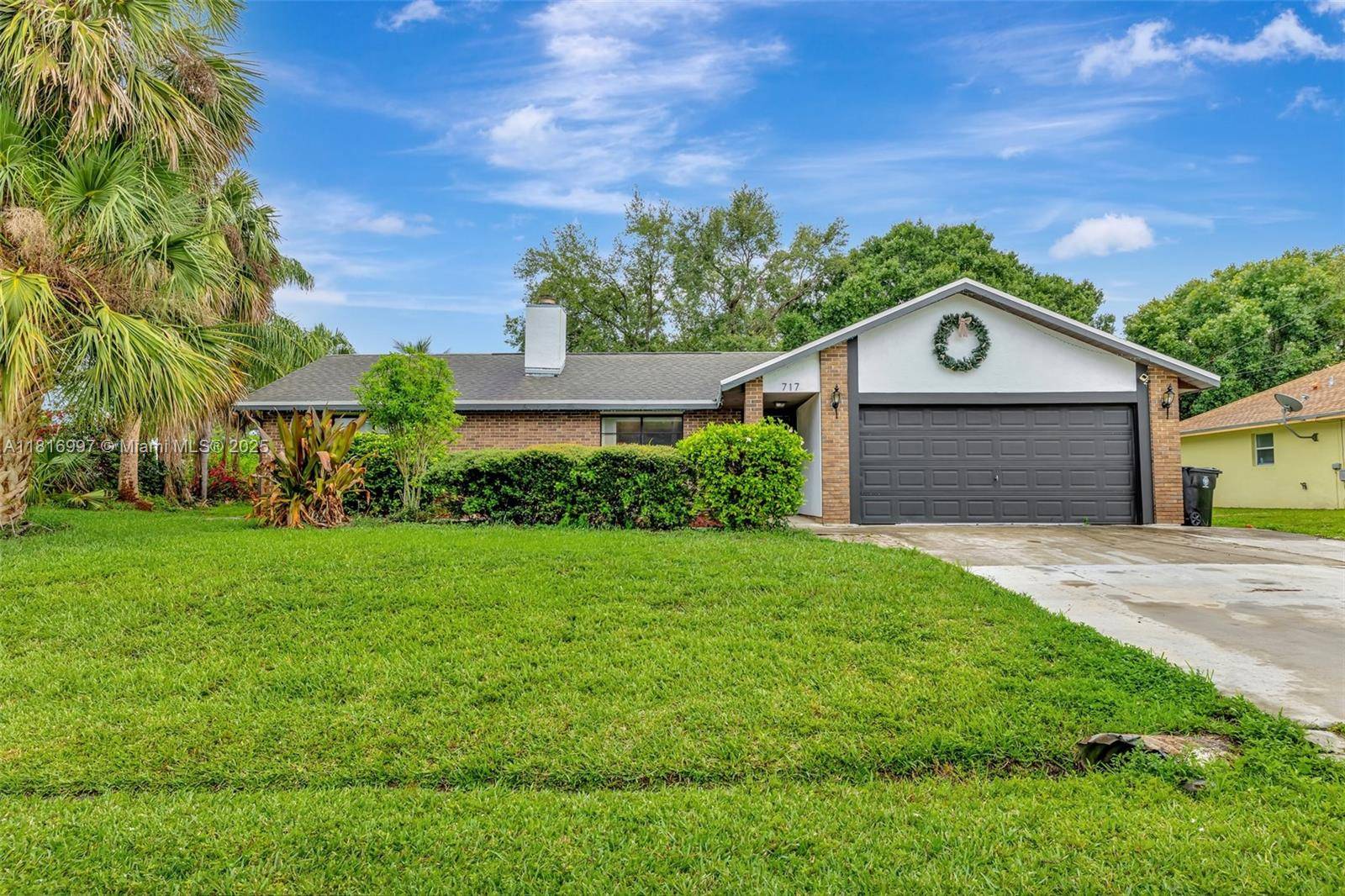 YOUR WAIT IS OVER..... CONTEMPORARY 4 Bed, 3 Bath, POOL HOME with Mother in Law Suite in Highly Sought After Port St Lucie.