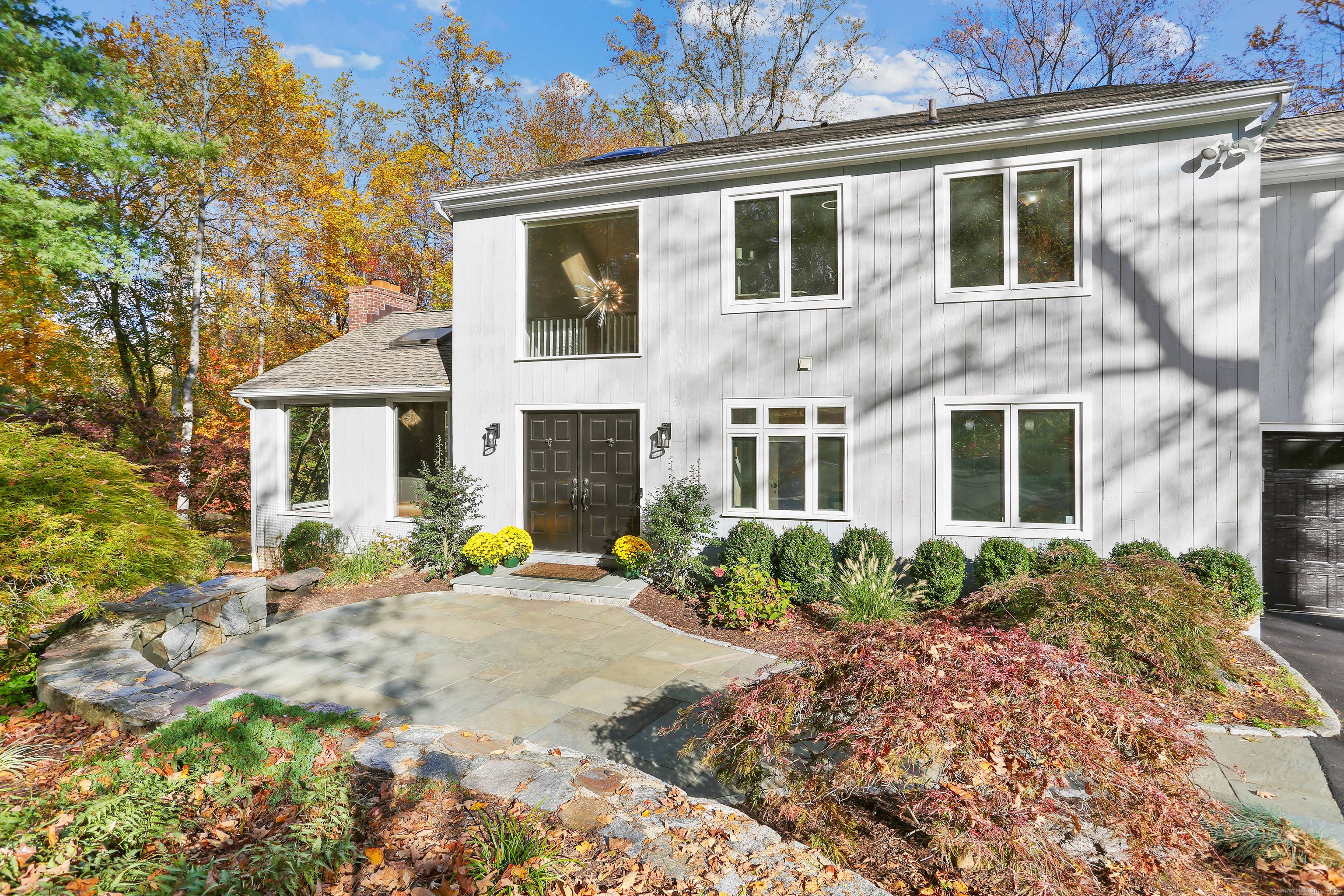 This 4, 400 sq ft house sits on an expansive 1 acre parcel in central Westport.