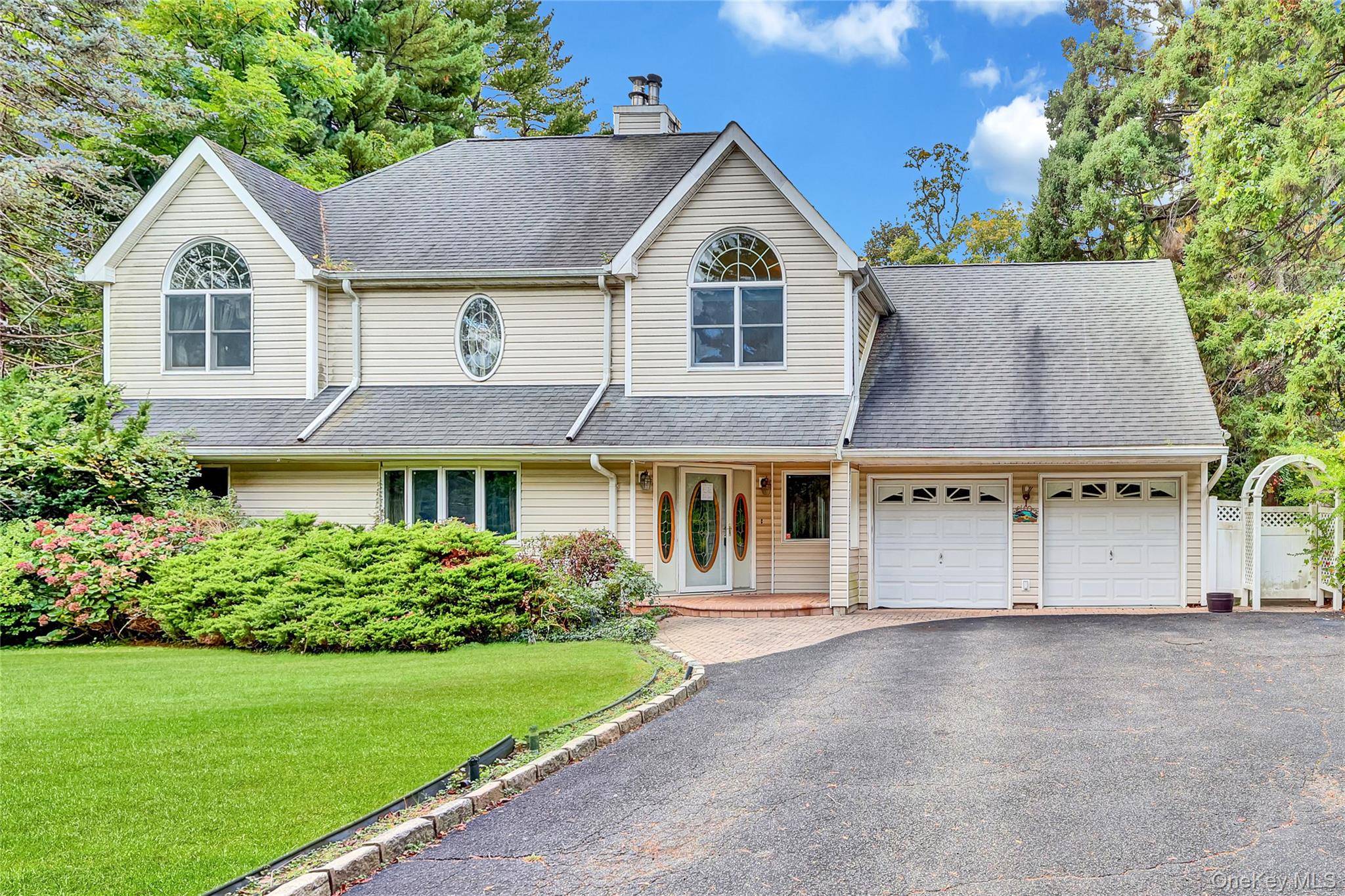 Large contemporary colonial style home, exceptionally located on a beautifully tree lined street.