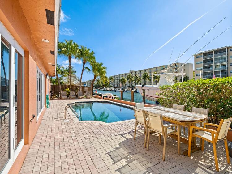 Lauderdale Harbours ! South facing 70' feet of deep water frontage No fixed bridges Direct ocean access 4 BD 4 BA residence offers an inviting pool, spacious living areas, boat ...