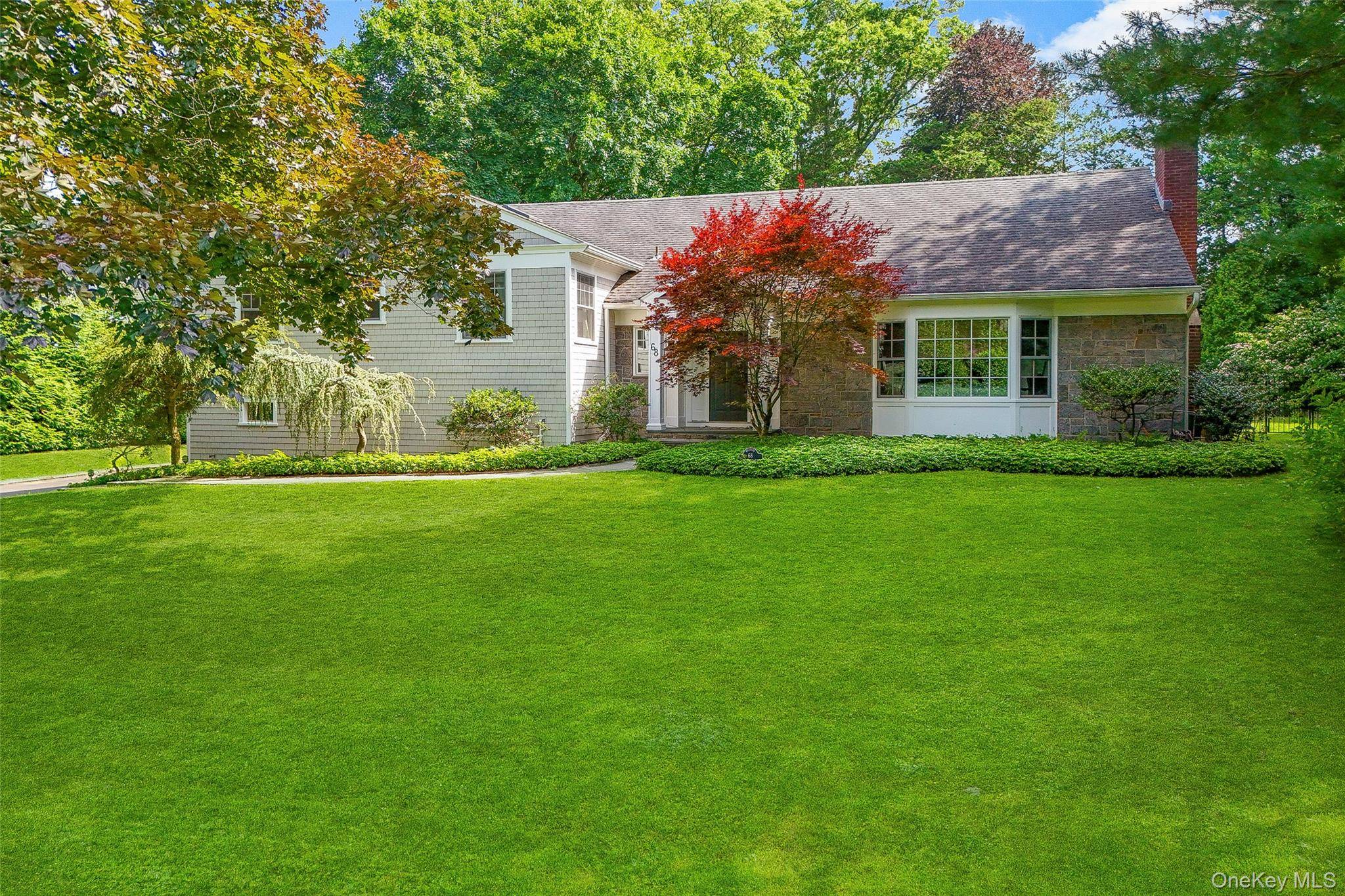 Discover the epitome of luxury and comfort in this stunning 5 bedroom, 3 1 2 bathroom residence, nestled in the prestigious community of Rye, New York.