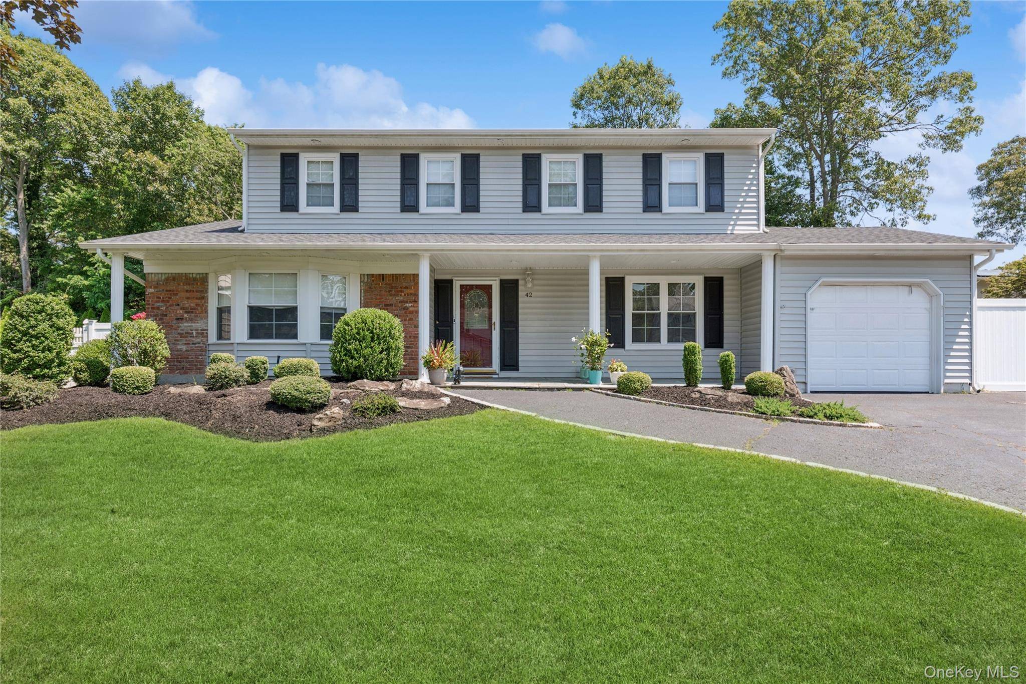 Spacious and Updated Colonial in Prime Lake Grove Location !
