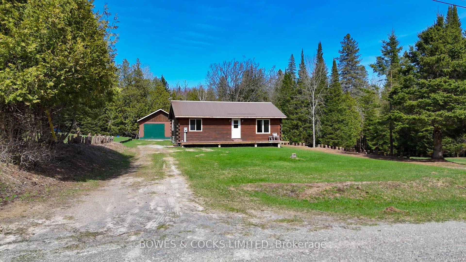 Welcome to 146 Rusaw Road, a delightful 2 bedroom log home nestled on a generous 1.