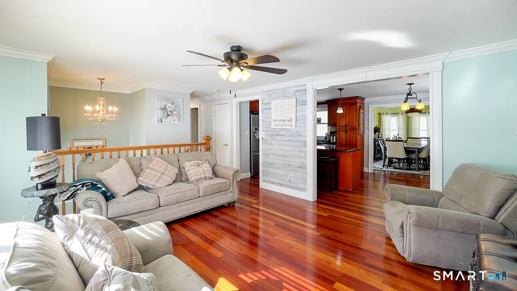 Light, bright, and updated Expanded Raised Ranch with a full solar panel system offering virtually no electric costs.