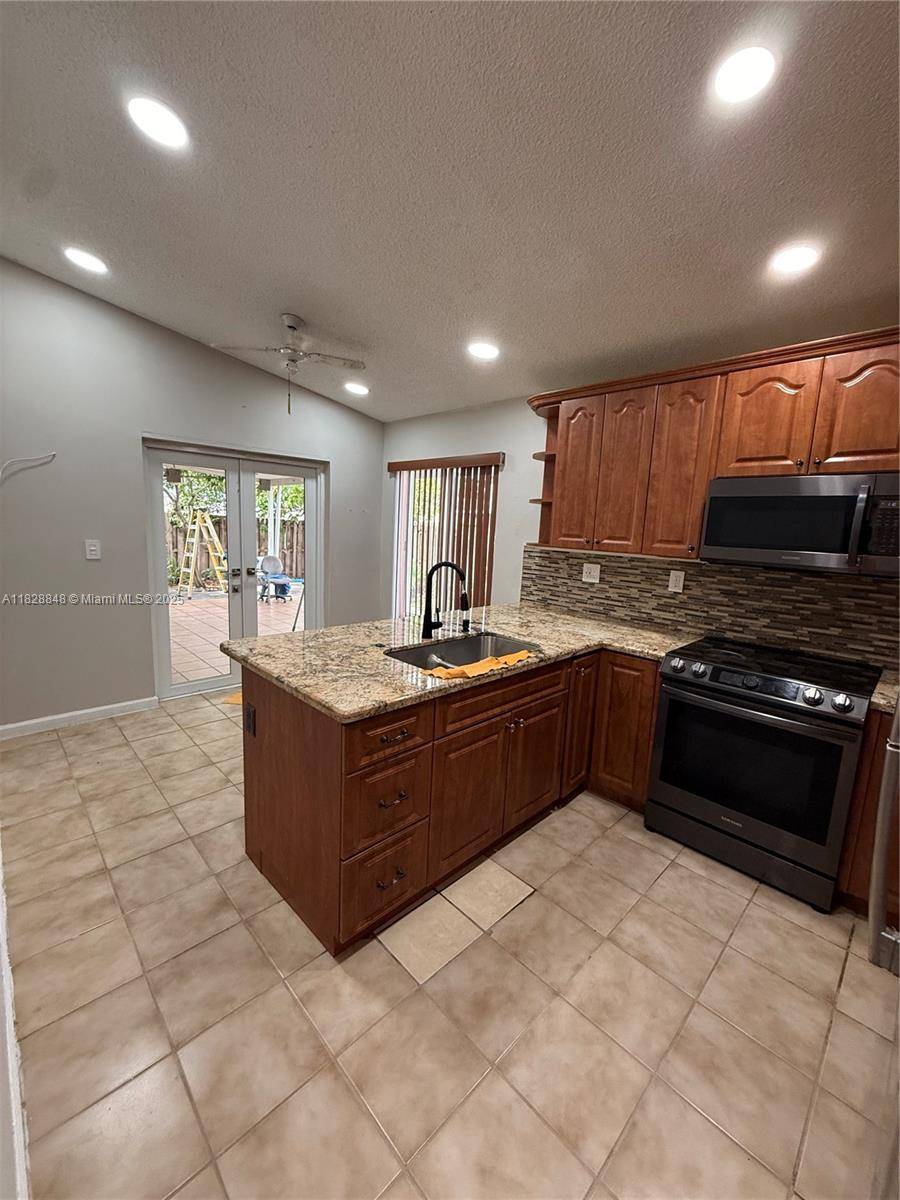 Welcome to 19926 NW 67th Pl a spacious 4 bedroom, 2 bathroom home in a desirable Northwest Miami location near Miami Lakes.