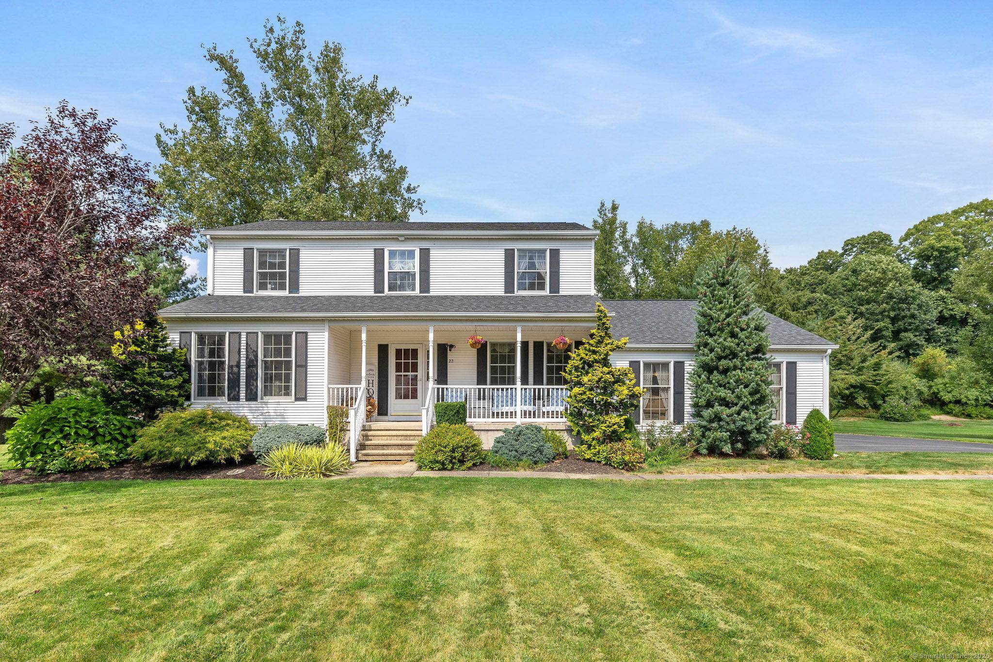 Nestled on a a quiet cul de sac in a sought after neighborhood, this inviting farmhouse style colonial sits on a beautiful level.