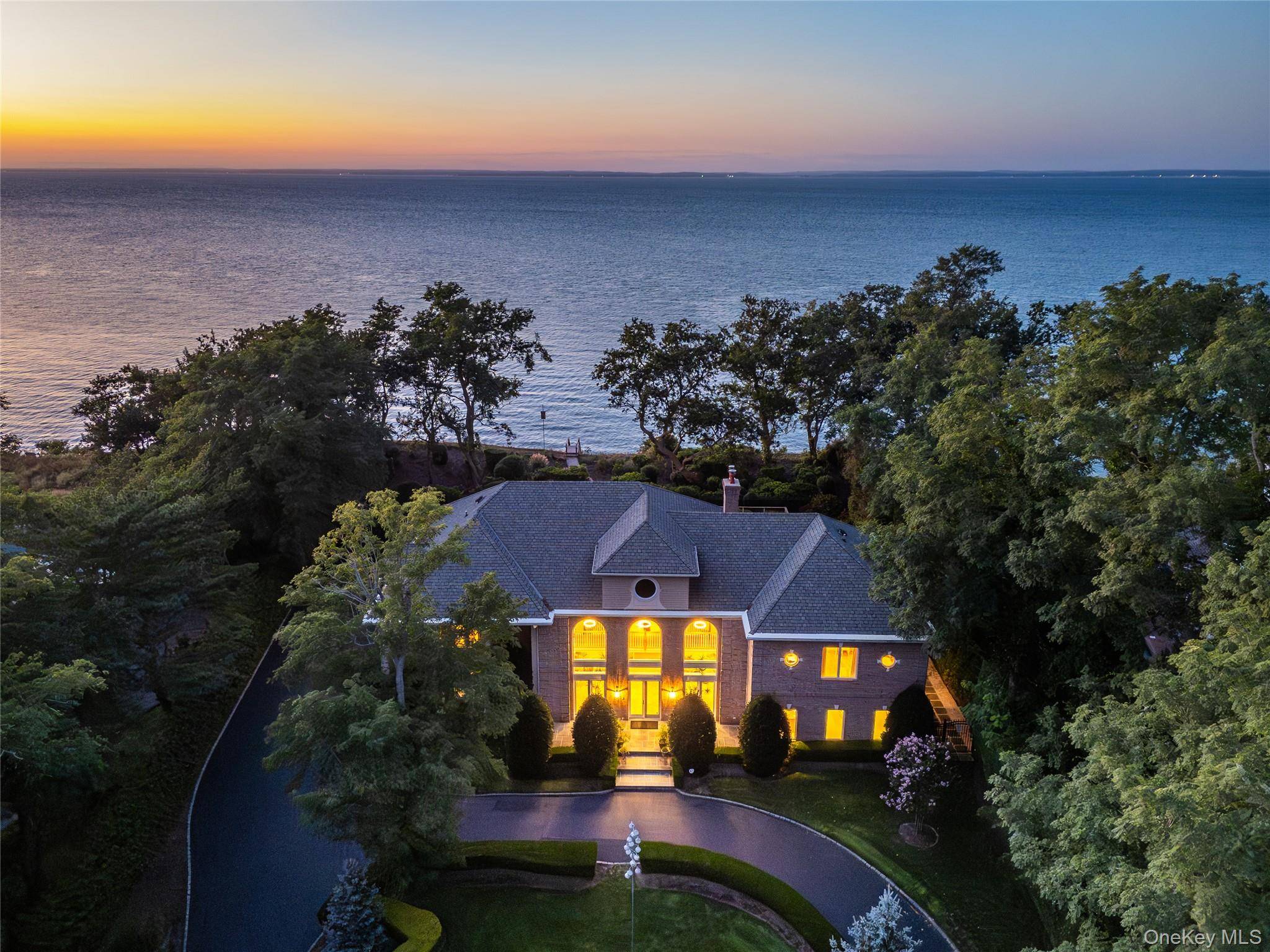 This Sound Front home at the edge of a quiet Orient cul de sac is more than a haven it's a destination for those who appreciate the rare union of ...