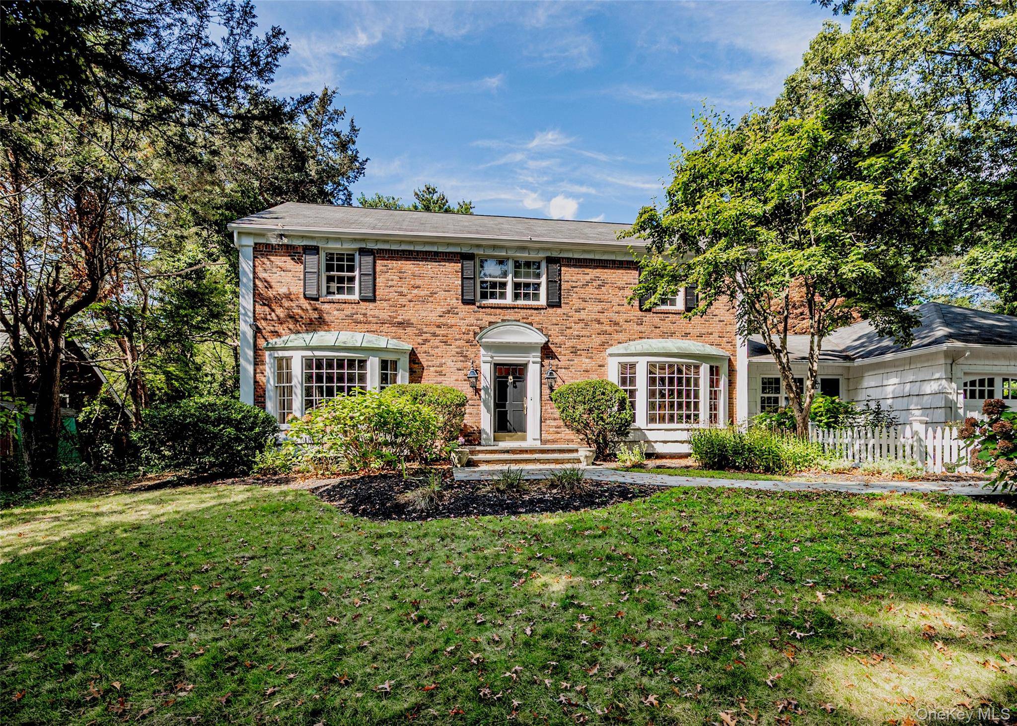 Expanded Colonial on shy half acre at the gateway to Lloyd Harbor.