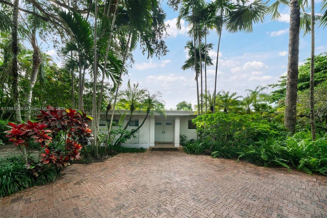 Explore the possibilities live, renovate, or create your dream estate on this distinguished property in Pinecrest.