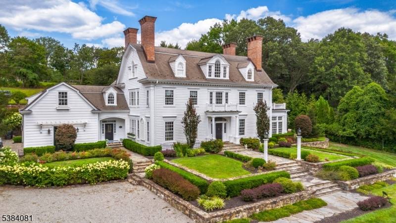 Entering the front gates, this Georgian Revival Colonial, newly built from the ground up in 2000, is sure to impress the most discriminating buyer.