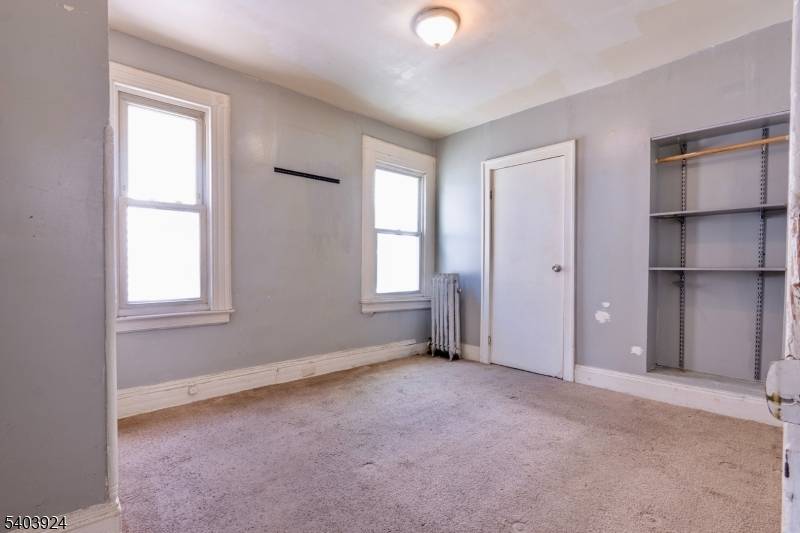 Multi family property featuring a vacant 2nd floor duplex unit, ideal for owner occupants or investors seeking strong rental potential.