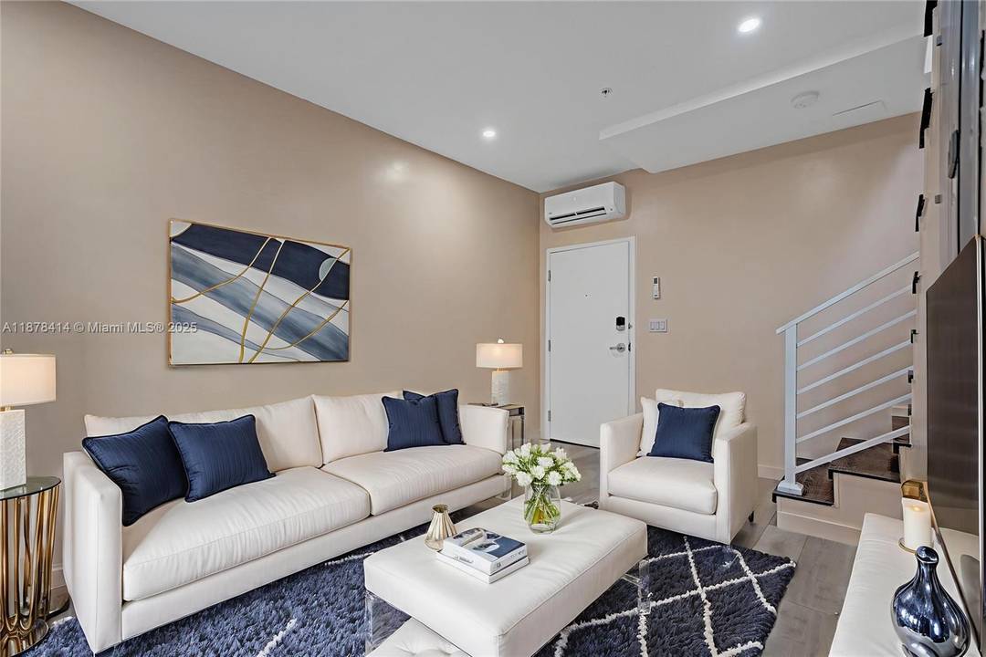 The unit features a functional layout with natural light, a well appointed kitchen, and comfortable living space.