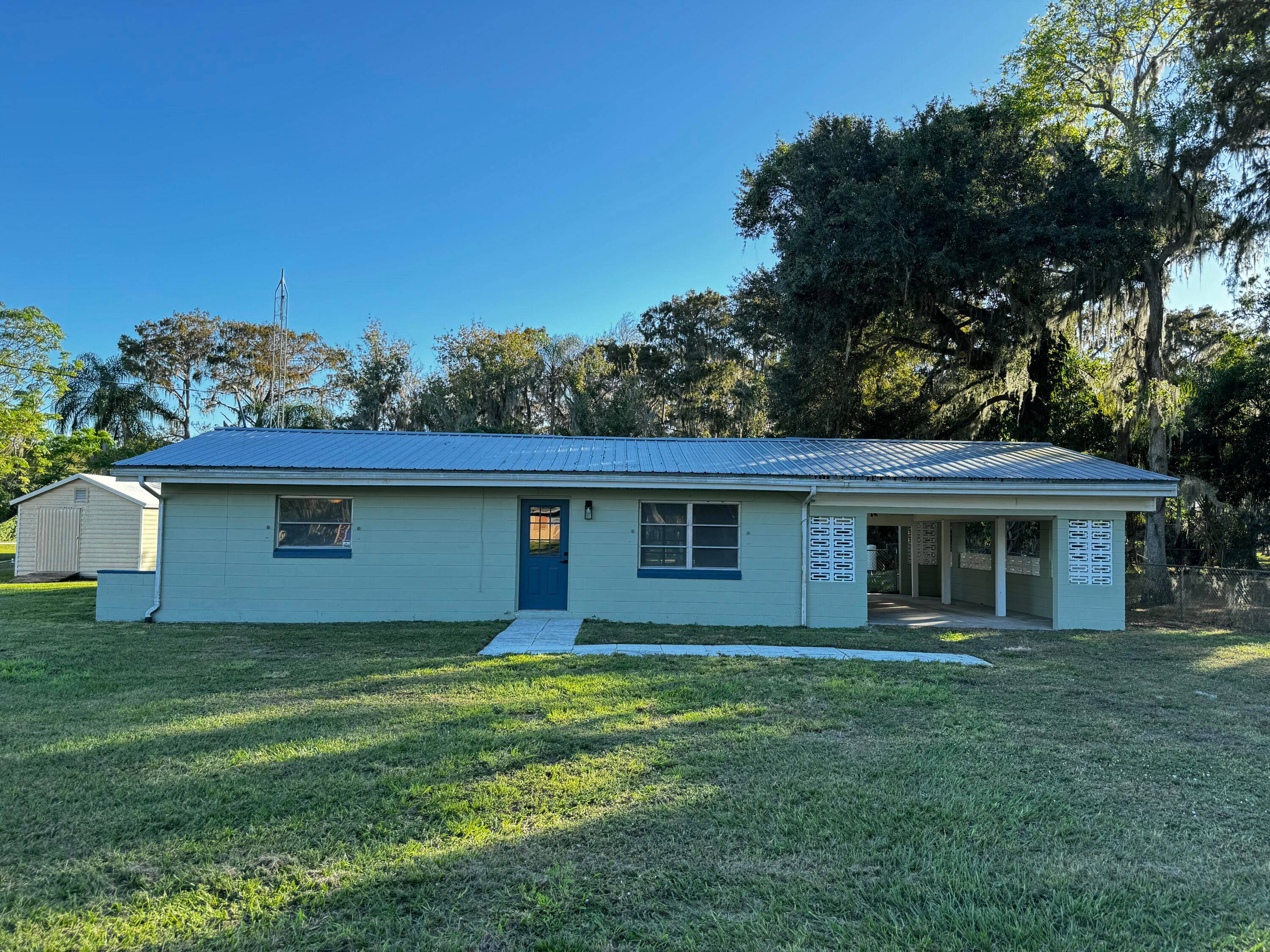 Canal front home on Lake Istokpoga with a large lot and water access !