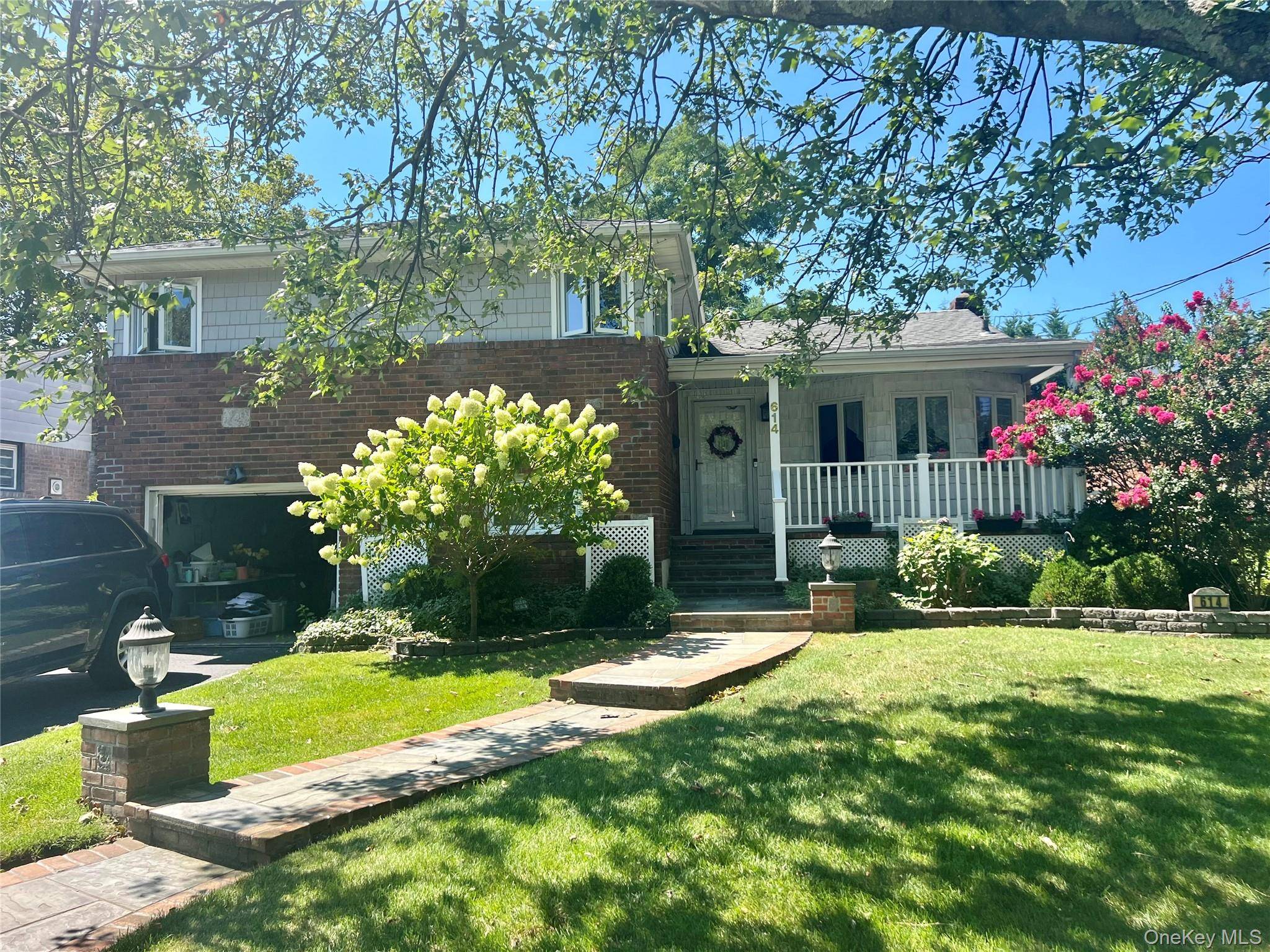 This beautifully split level home, situated in a quiet cul de sac, boasts tremendous curb appeal, features 4 bedrooms and 3 bathrooms, Main level includes a foyer, a warm and ...