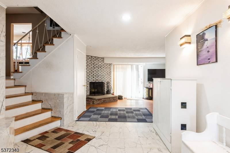 Stunning 5 bedroom 2. 1 bath custom split level located in the highly desired town of Mountainside.
