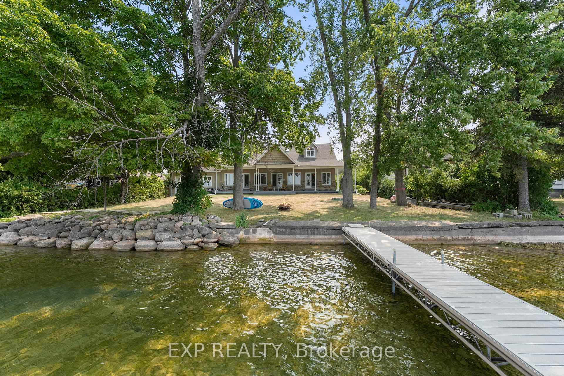 Welcome To A True Year Round Retreat With Rare Western Exposure And 100 Feet Of Clear, Swimmable Shoreline.