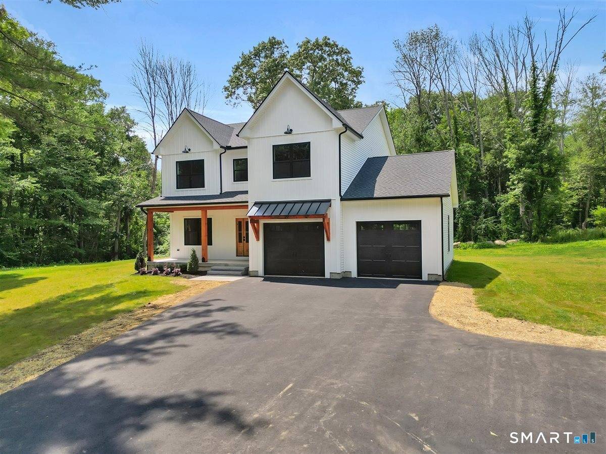 Welcome to this stunning newly constructed home in Eastford, Connecticut, where modern craftsmanship meets the tranquility of a picturesque wooded setting.