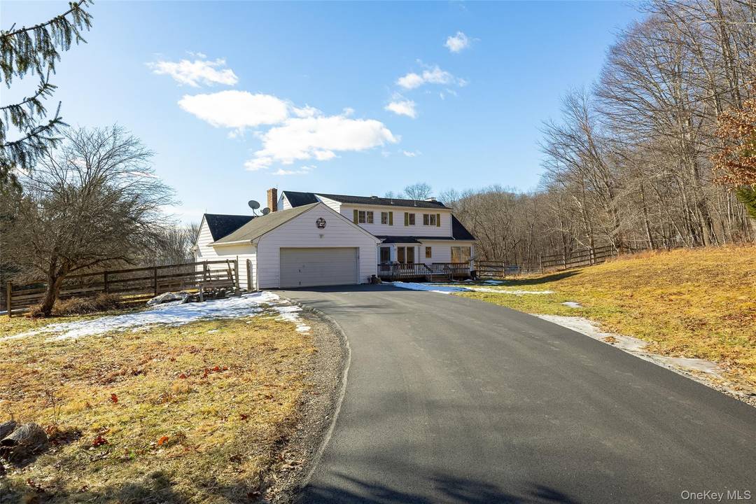 Tucked away on nearly 6 private acres in the beautiful Millbrook countryside, this 3 bedroom, 4 bath Cape offers space, privacy, and charm.