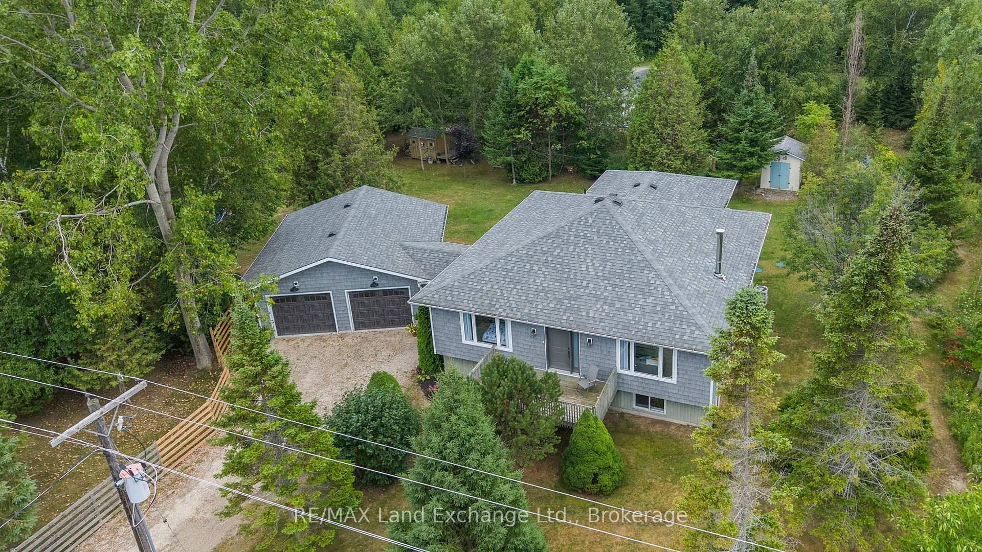 Tucked away on a private, treed 200 by 125 foot lot, this beautiful updated home offers the perfect blend of comfort, functionality and location just steps from sandy beach and ...