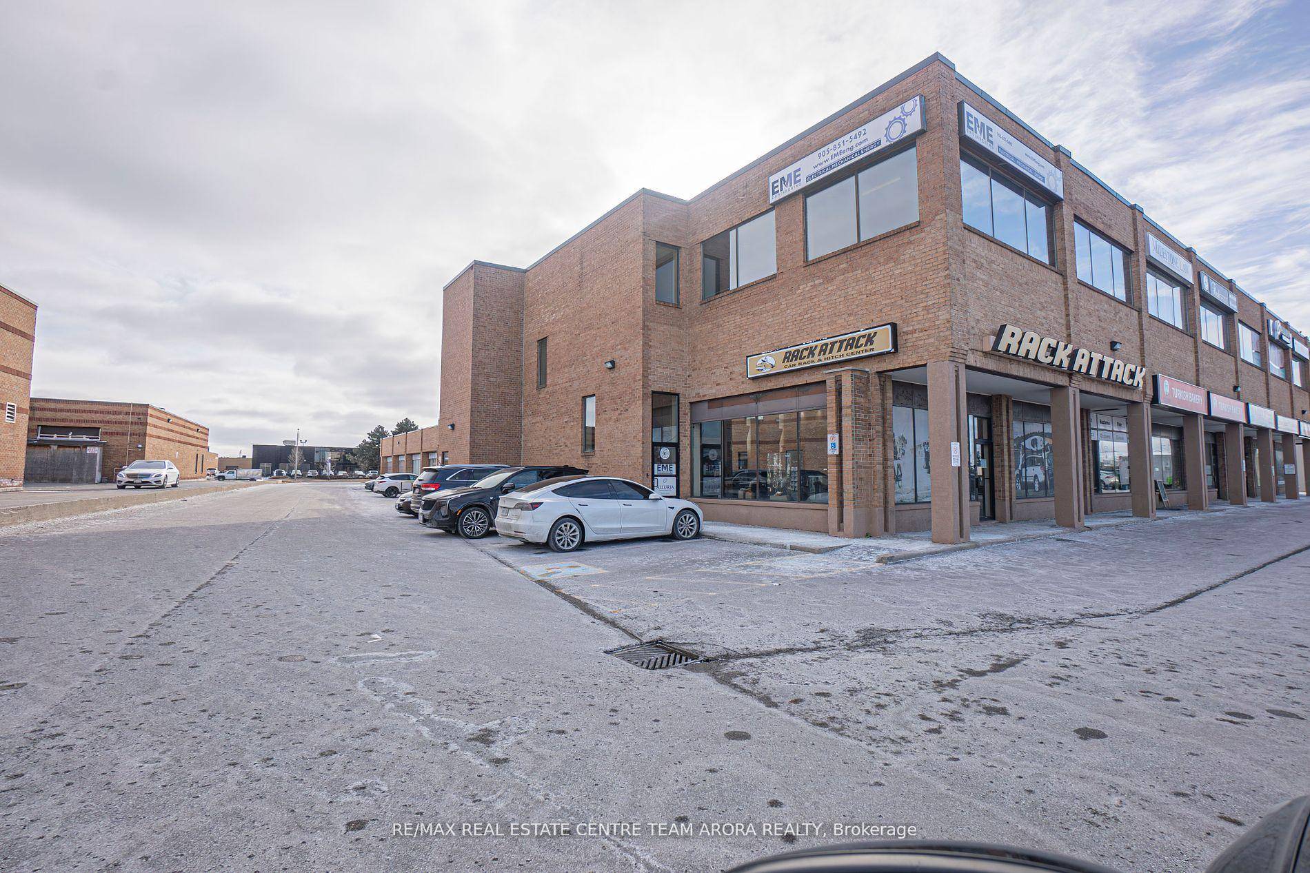 Income generating professional office unit with abundance of Natural Light.