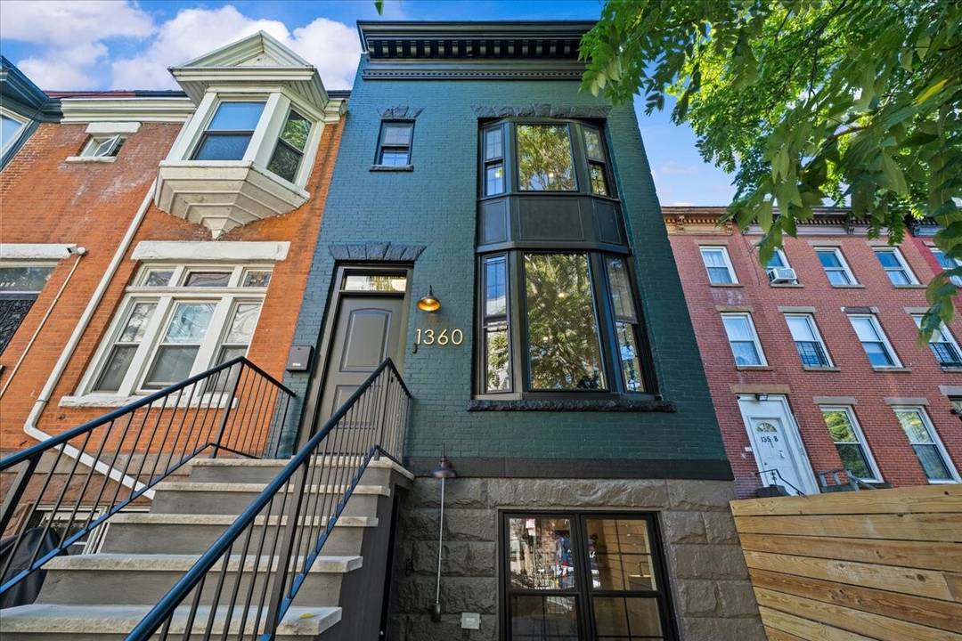 Welcome home to this masterfully gut renovated two family brick townhouse on one of Crown Heights' most beautiful landmarked blocks.