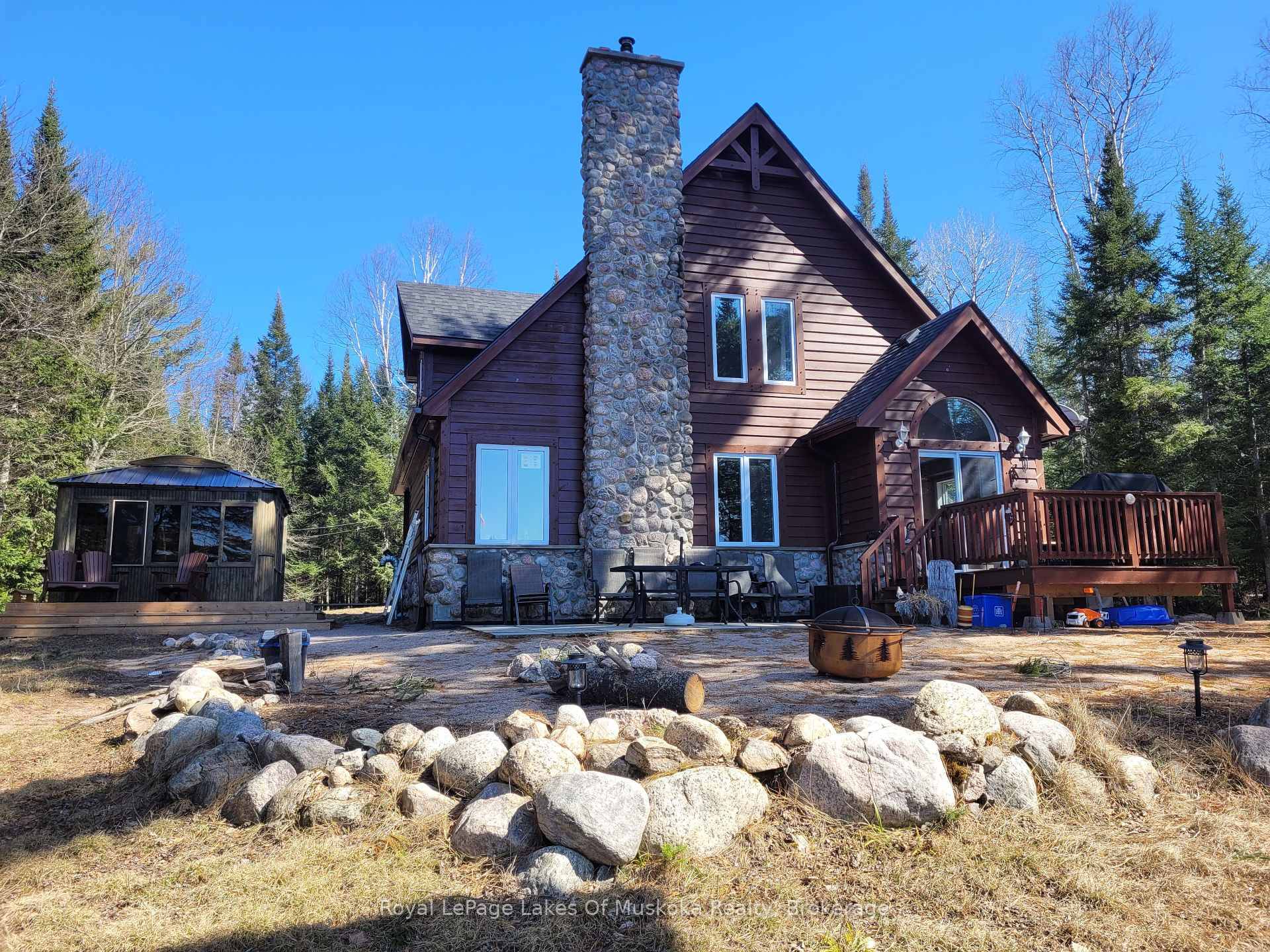 Discover this beautiful country home cottage, set on over 5 acres with 300 plus feet of frontage on the scenic Forest Lake South River.