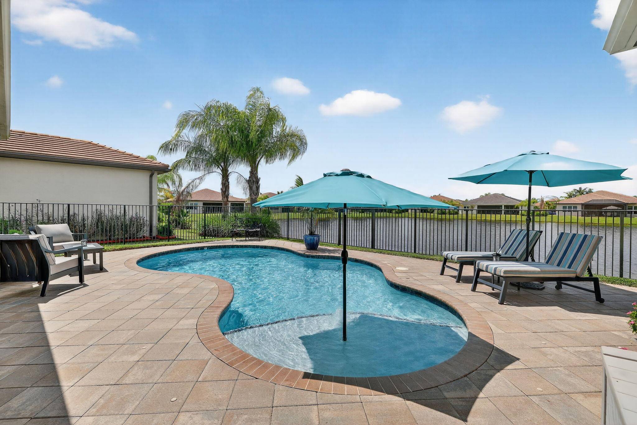 Experience Luxury Living at its finest, in a lakefront Julia Model at Valencia Cay in Riverland.