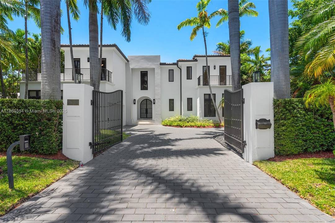 Completely reimagined and renovated in 2022, this Bal Harbour Village estate combines modern luxury with timeless elegance.