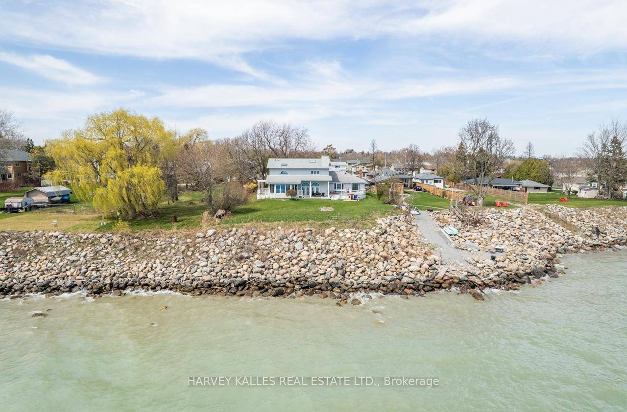 Welcome to 477 Stone St This custom built open concept executive home features a pristine 100 ft lake frontage.