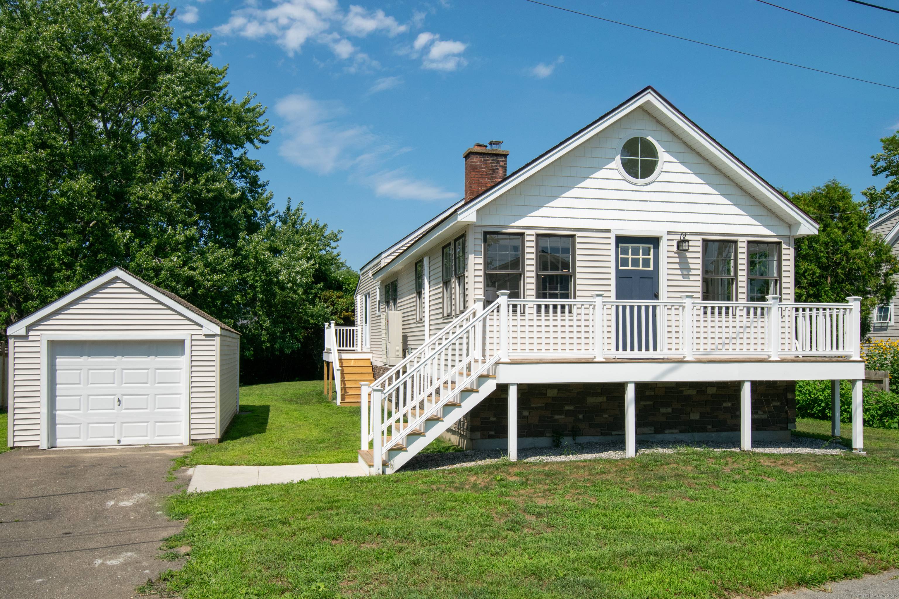 This FEMA compliant coastal residence in Old Saybrook offers panoramic views of South Cove at the mouth of the Connecticut River, where the river meets the sound.
