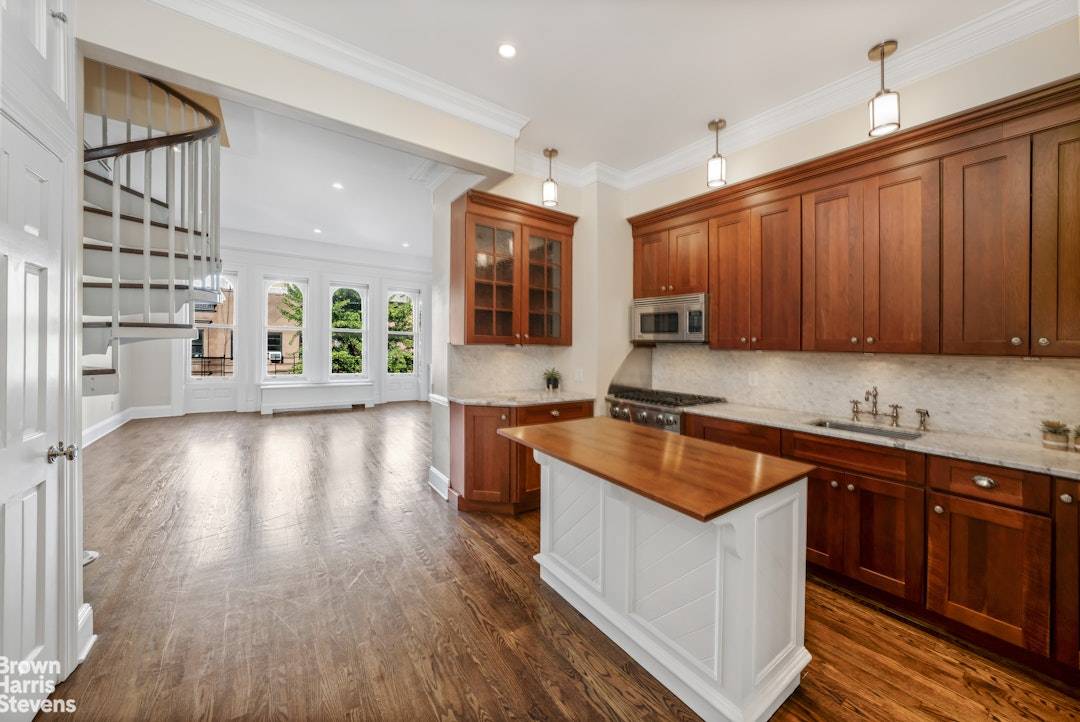 This absolutely beautiful floor through home is located on the top floor of a classic New York City brownstone.