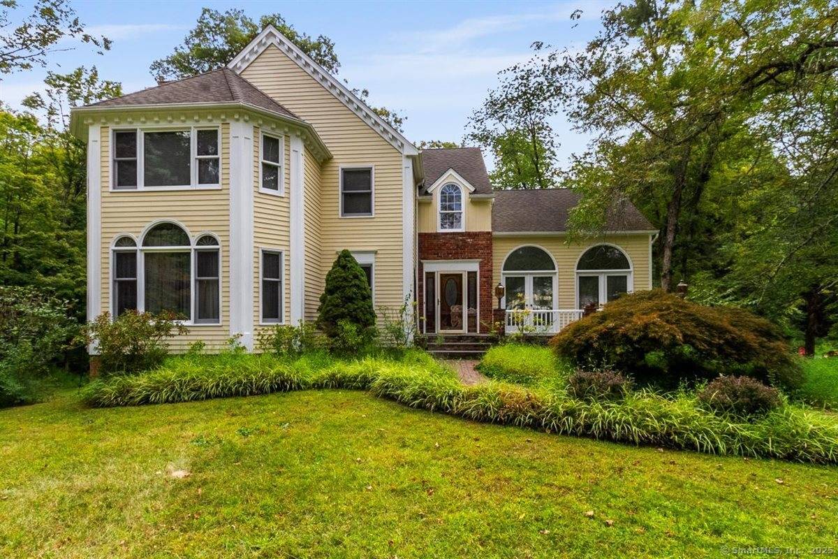 This beautiful and distinctive custom built Victorian style Colonial is located in the highly sought after Barkwood Falls area of Brookfield.