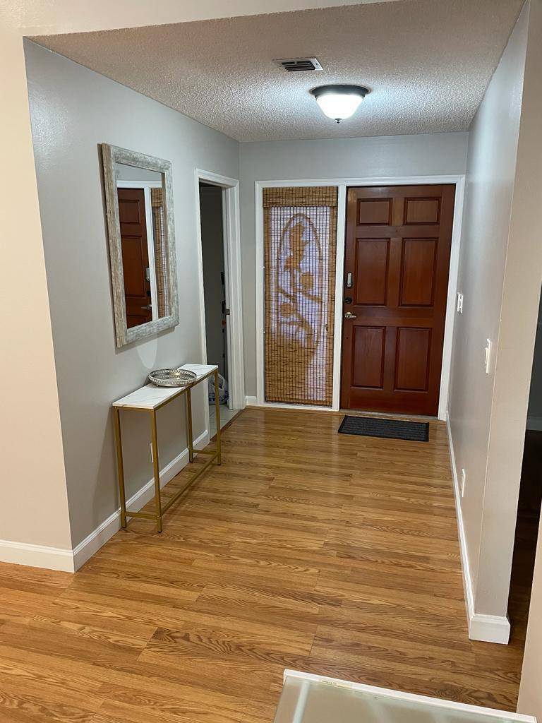 Beautiful 3 3 home in Central Boca Raton with Private Screened in Pool and an abundance of outdoor living space for entertaining.