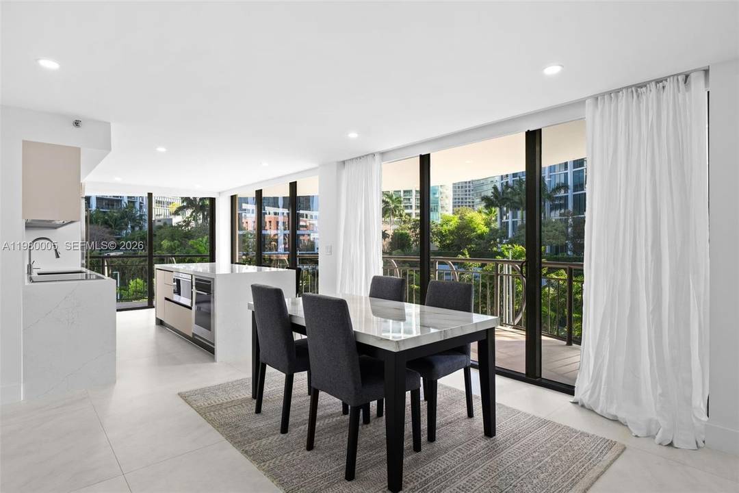 Beautifully renovated 3BD 3BA residence in Grove Towers featuring abundant natural light and a sleek, modern interior.