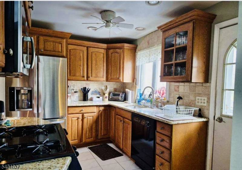 This beautiful ranch offers two bedroom, eat in kitchen with custom oak cabinets, granite counters and skylight.