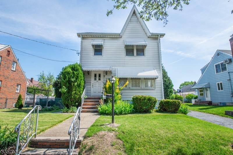 Amazing Location ! 2 family home features 2 large apartments, partially finished basement w french drains, full attic, fenced back yard with beautiful landscaping, 2 car garage, driveway and so ...